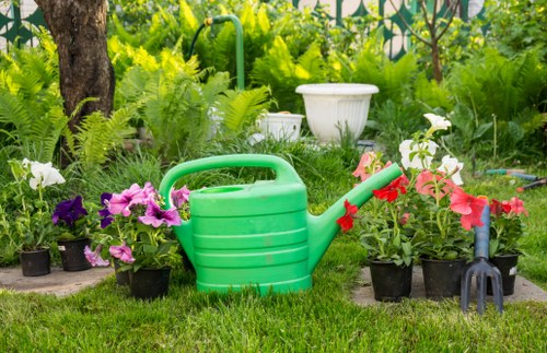 Gardeners Tokyngton managing recyclable green waste in a sustainable garden setting